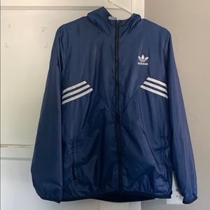 Blue adidas windbreaker.